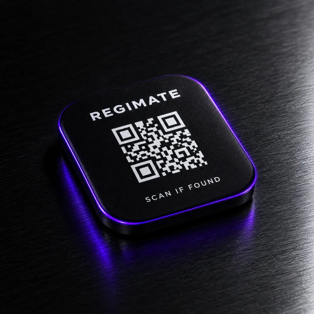 A black Regimate tag with a QR code and the words Scan if found